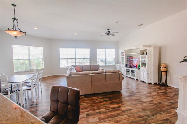 living room with lofted ceiling, a wealth of natural light, ceiling fan, and dark hardwood / wood-style floors