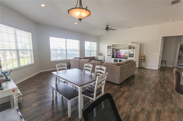 dining space with dark hardwood / wood-style floors, ceiling fan, and lofted ceiling