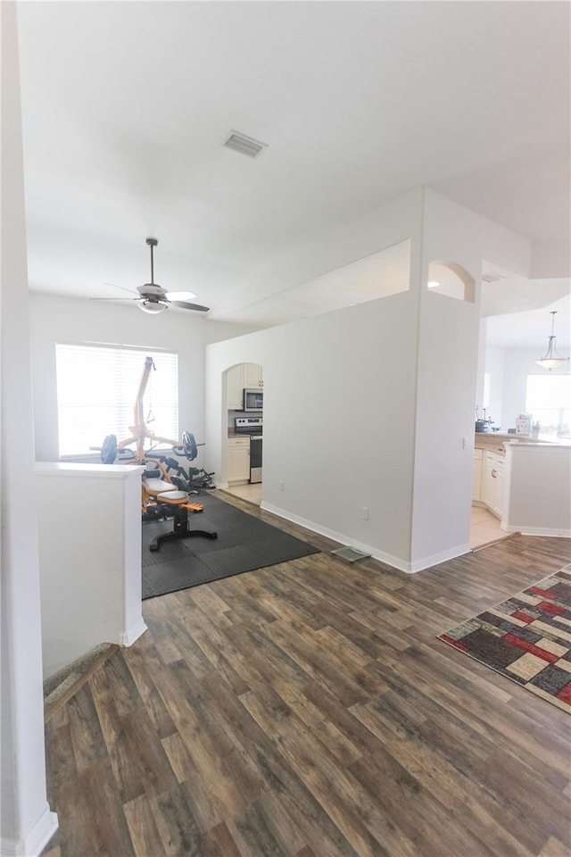 interior space with hardwood / wood-style floors, ceiling fan, and a wealth of natural light