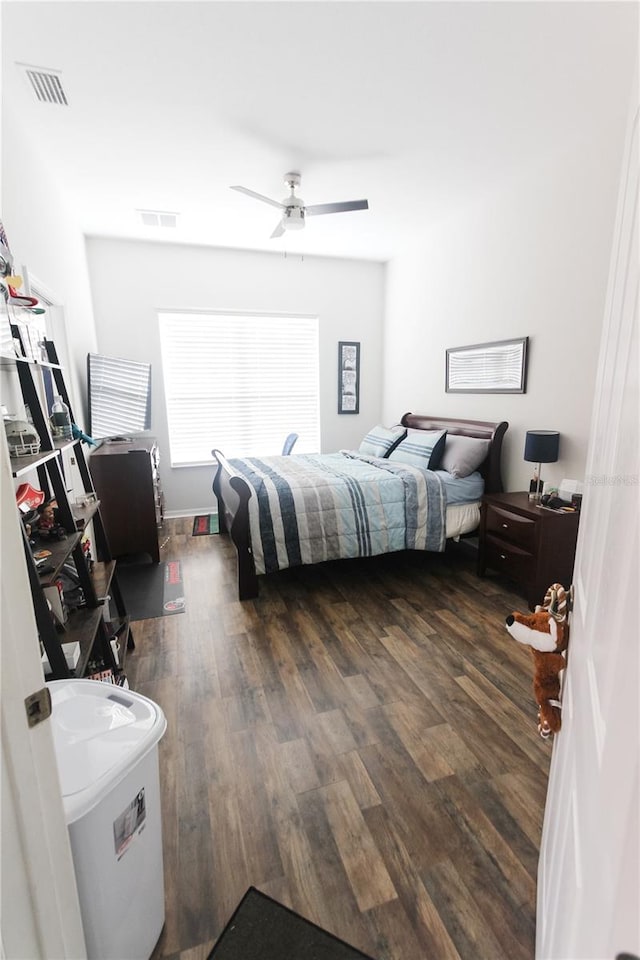 bedroom featuring ceiling fan and dark wood-type flooring