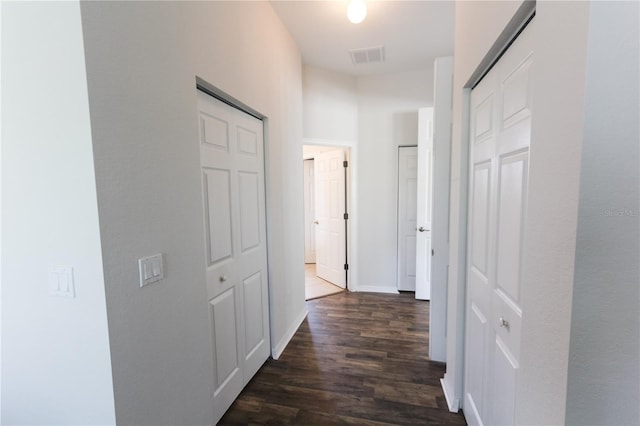 hall with dark hardwood / wood-style floors