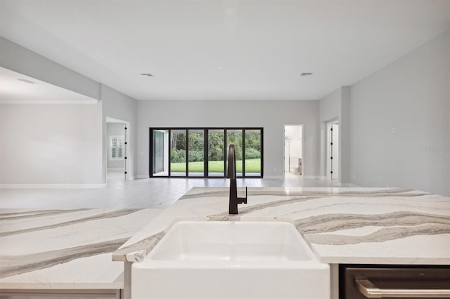 kitchen featuring beverage cooler, wood-type flooring, and sink