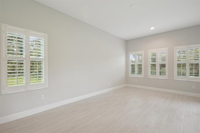 spare room with light wood-type flooring