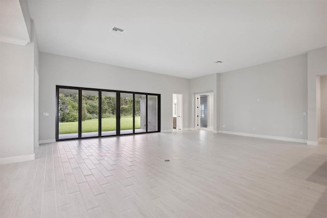 empty room with light hardwood / wood-style floors