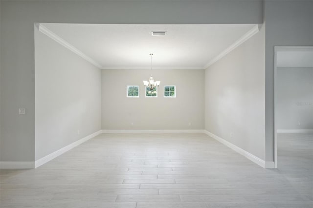 unfurnished dining area with a notable chandelier, crown molding, and light hardwood / wood-style floors