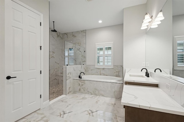 bathroom featuring plus walk in shower and vanity