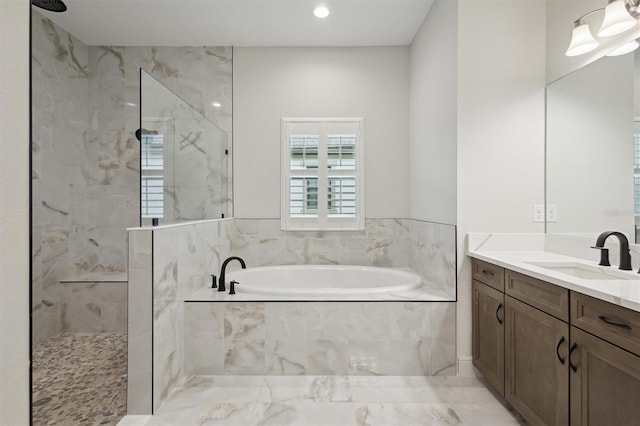 bathroom with vanity and separate shower and tub