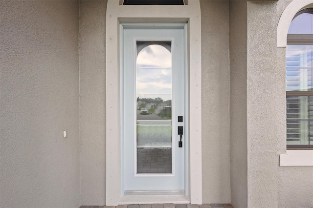 entrance to property featuring elevator