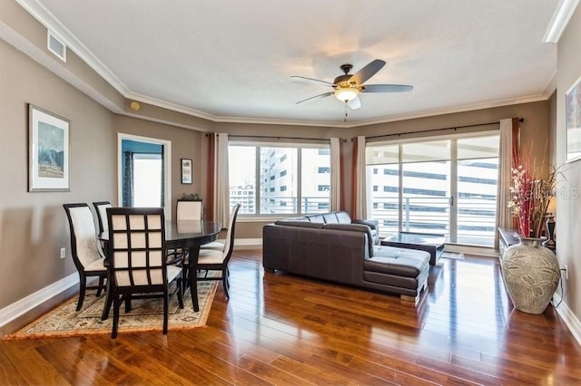 living room featuring ornamental molding, hardwood / wood-style flooring, and ceiling fan