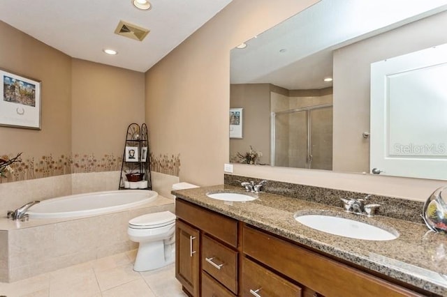 full bathroom with tile patterned floors, double vanity, plus walk in shower, and toilet