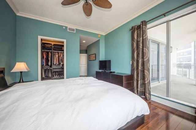 bedroom featuring ceiling fan, hardwood / wood-style floors, and crown molding