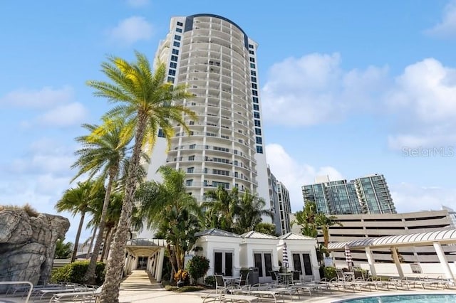 view of building exterior featuring a community pool