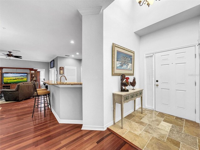 entrance foyer with ceiling fan