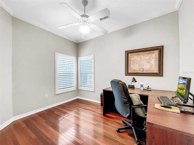 office featuring ceiling fan, wood-type flooring, and ornamental molding