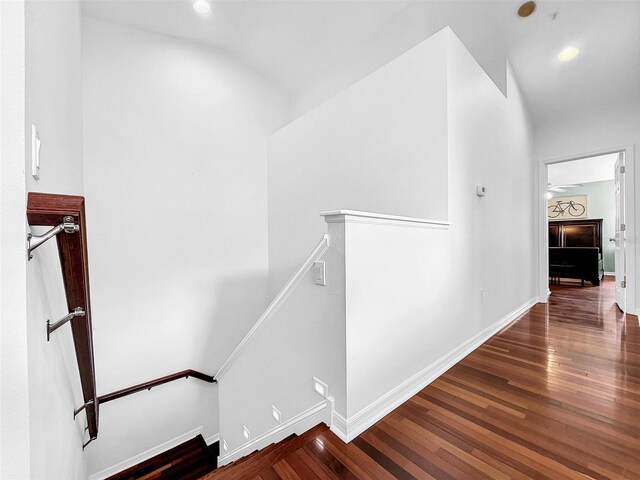 stairway with hardwood / wood-style floors