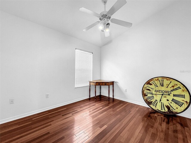 unfurnished room with ceiling fan and dark hardwood / wood-style floors