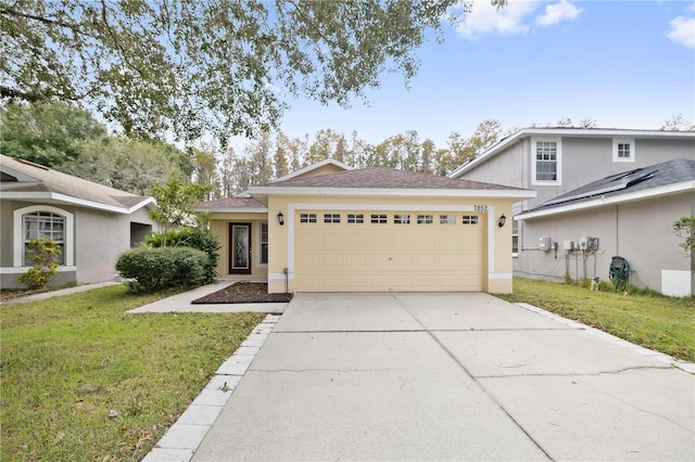 view of front of house with a garage and a front lawn