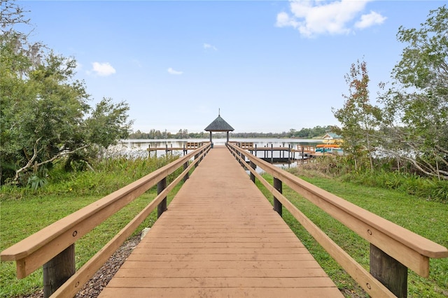 dock area with a gazebo and a water view