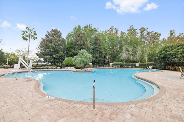 view of pool featuring a patio area