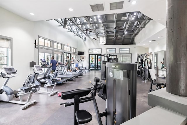 exercise room featuring a high ceiling