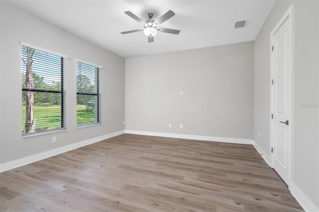 unfurnished room featuring ceiling fan and light hardwood / wood-style flooring