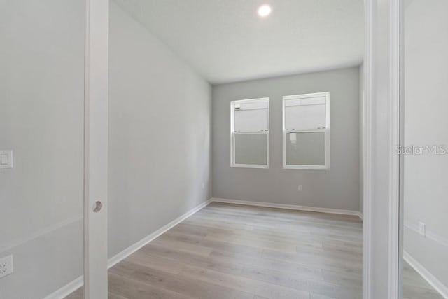 spare room with light hardwood / wood-style floors