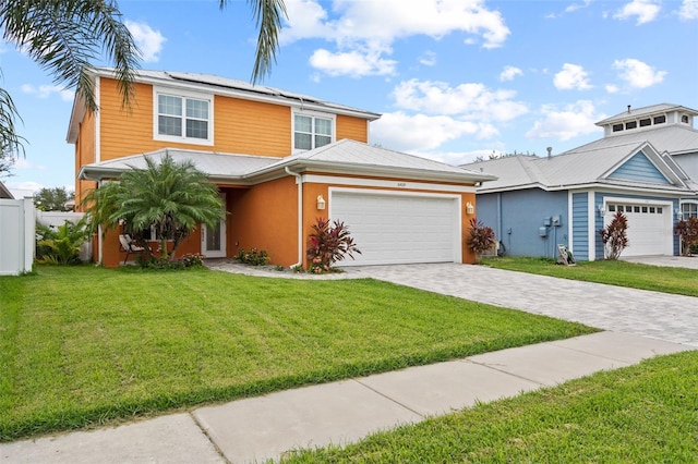 view of front of home with a garage and a front yard