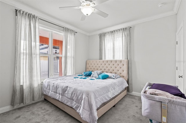 bedroom featuring light colored carpet, ceiling fan, and ornamental molding