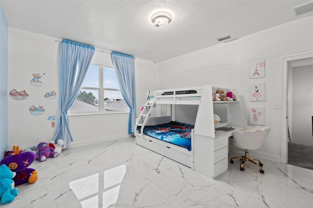 bedroom with a textured ceiling