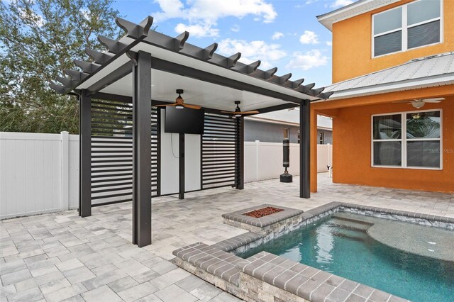 exterior space featuring ceiling fan, a pergola, and a patio area