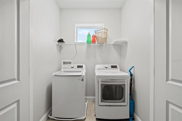 laundry room featuring washing machine and clothes dryer