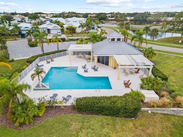 view of pool featuring a patio area, a gazebo, a yard, and a water view