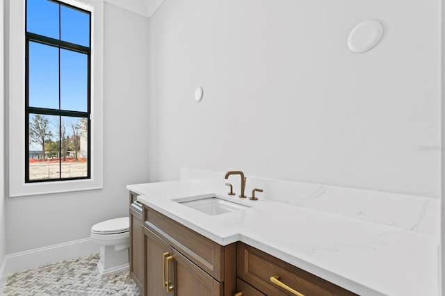 bathroom with vanity and toilet