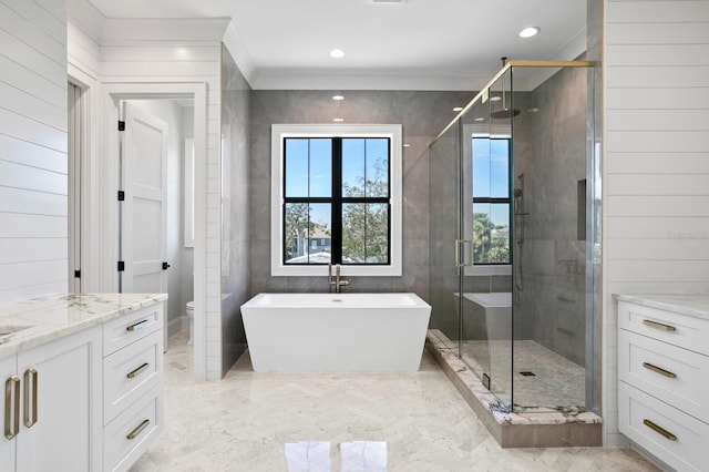 full bathroom with vanity, crown molding, independent shower and bath, and toilet