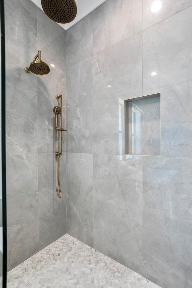 bathroom with tiled shower