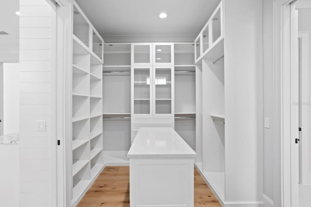 walk in closet featuring light hardwood / wood-style flooring