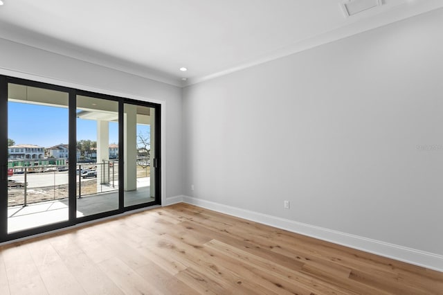 empty room with light hardwood / wood-style flooring