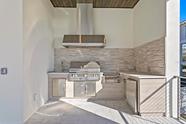view of patio featuring a grill, exterior kitchen, and sink