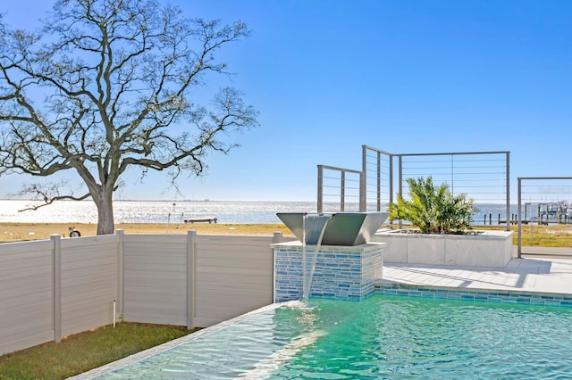 view of pool featuring a water view
