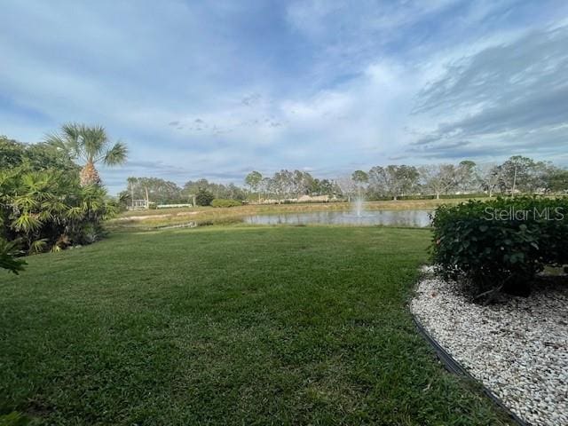 view of yard with a water view