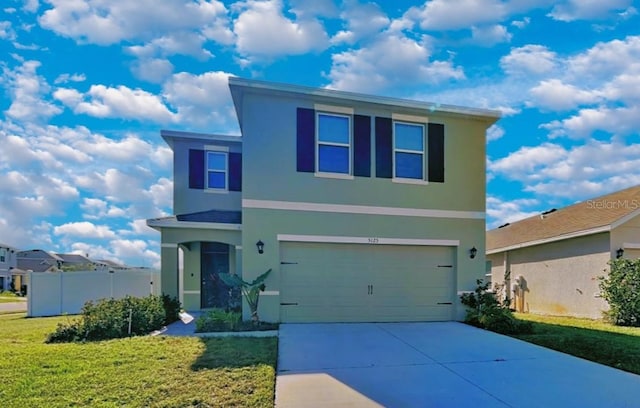 front facade featuring a garage and a front lawn