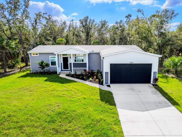 ranch-style house with a garage, covered porch, and a front yard