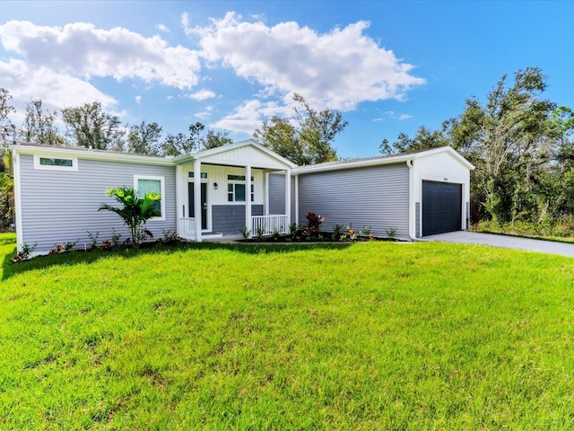 ranch-style house with covered porch, a garage, and a front lawn