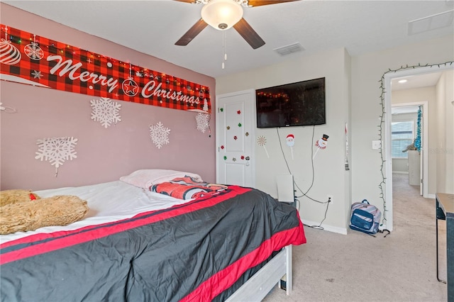 carpeted bedroom featuring ceiling fan