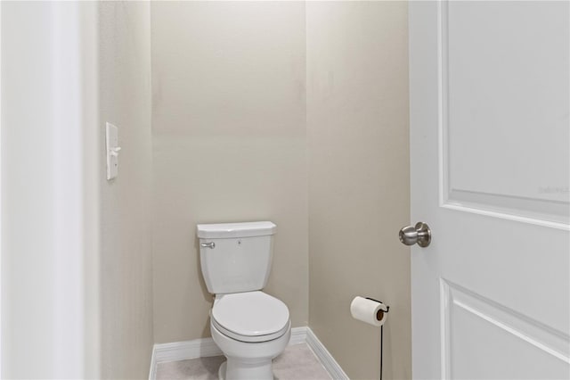 bathroom with tile patterned flooring and toilet