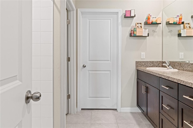 bathroom featuring tile patterned flooring and vanity