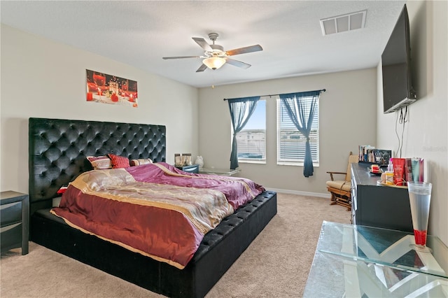 bedroom featuring ceiling fan and light colored carpet