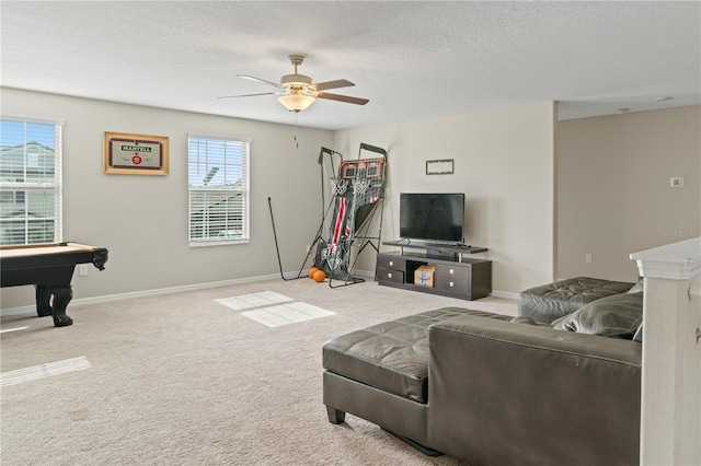 carpeted living room featuring a textured ceiling, ceiling fan, and billiards