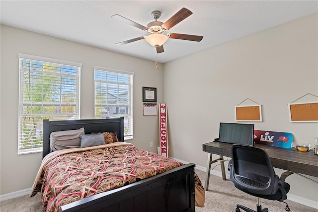 bedroom with ceiling fan and light colored carpet