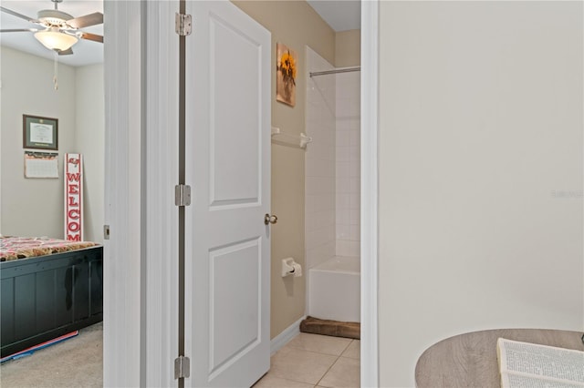 bathroom featuring tile patterned flooring, ceiling fan, and  shower combination